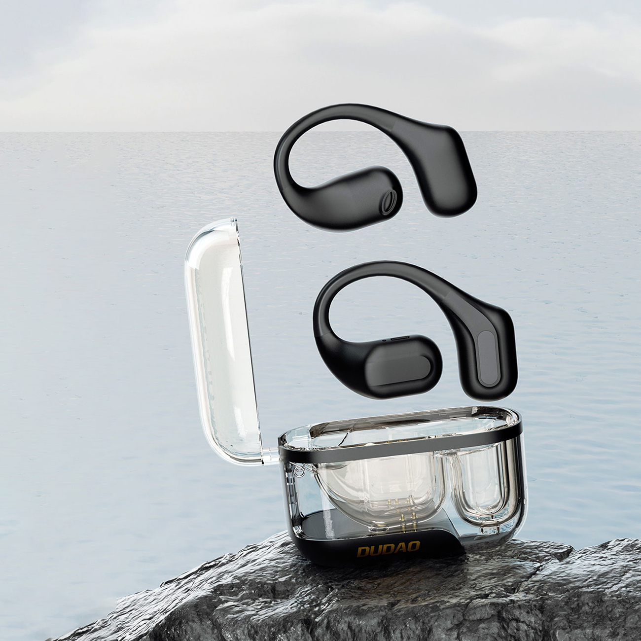 Dudao U17Pro on-ear wireless headphones in a case on a rock, with the sea in the background