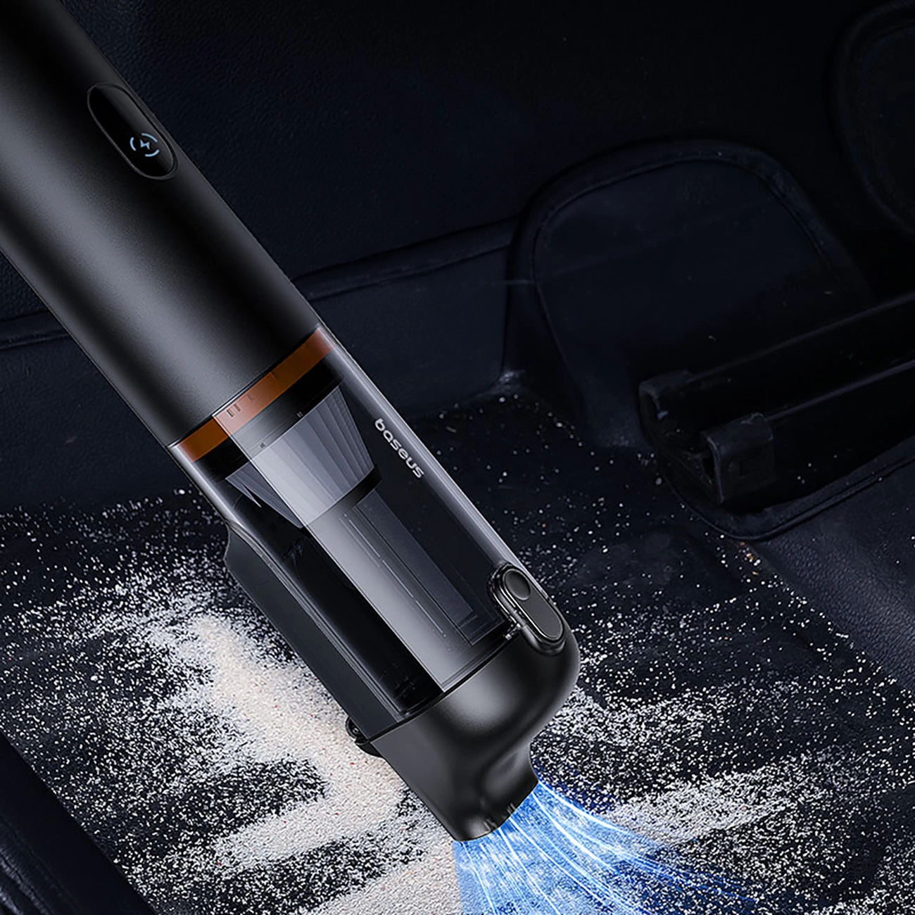 The Baseus A5 Air car vacuum cleaner sucks up spilled powder from the floor