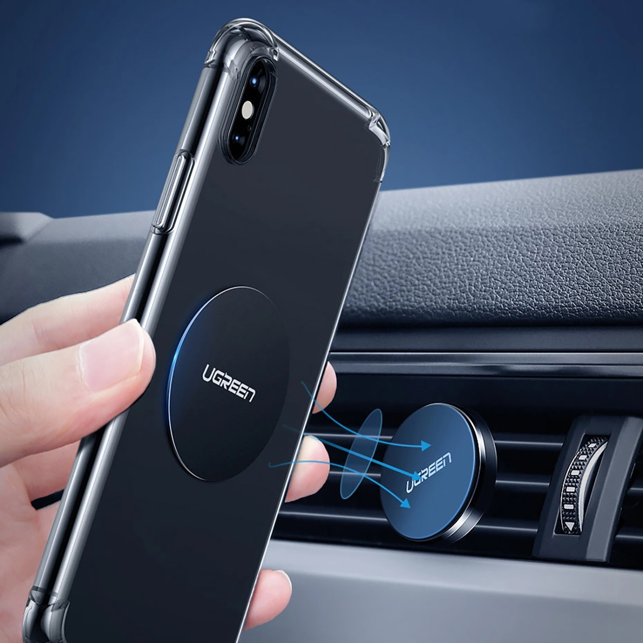 The phone is attached to the car holder using the Ugreen LP123 magnetic holder plate