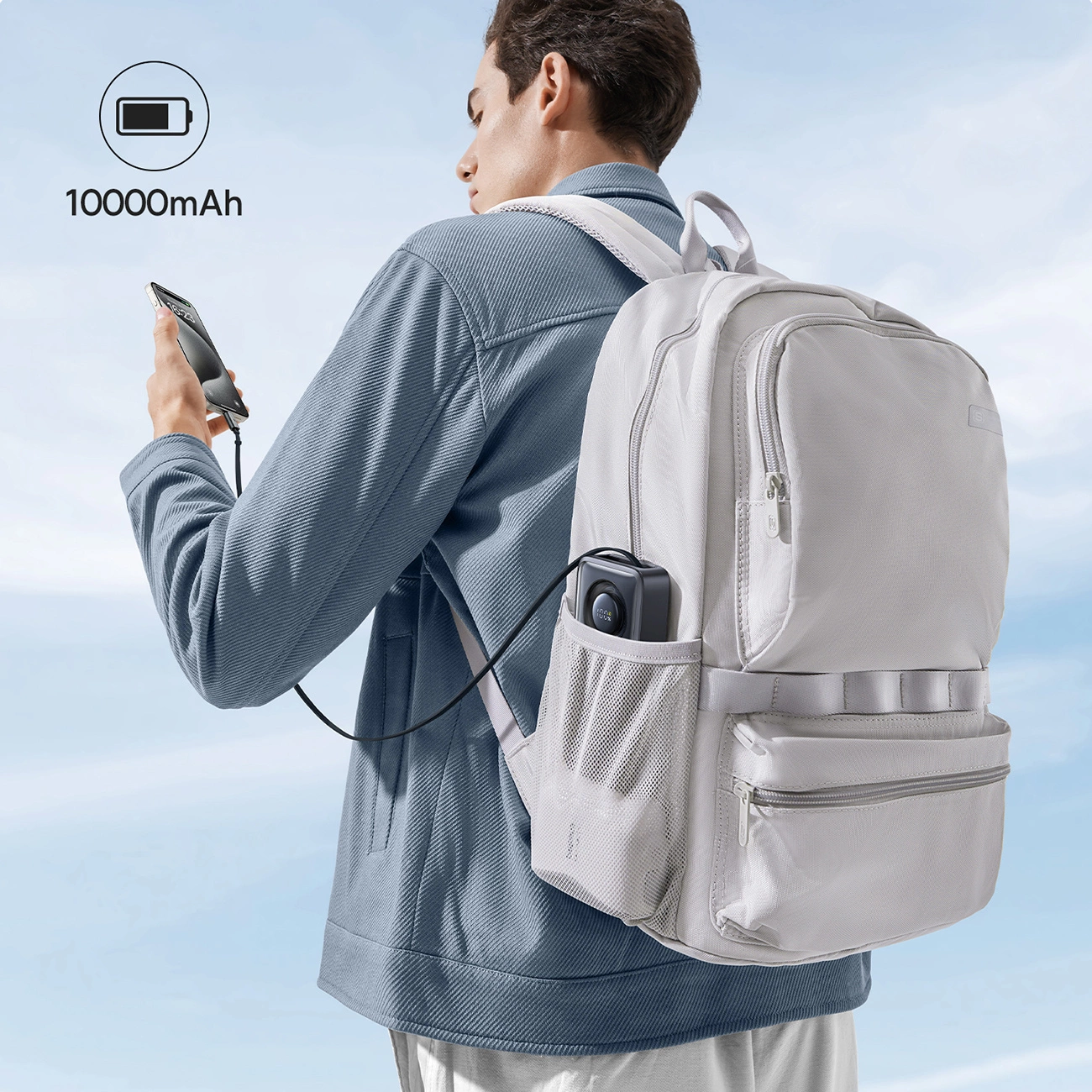 The man carries the Baseus Free2Pull Powerbank in the side pocket of his backpack