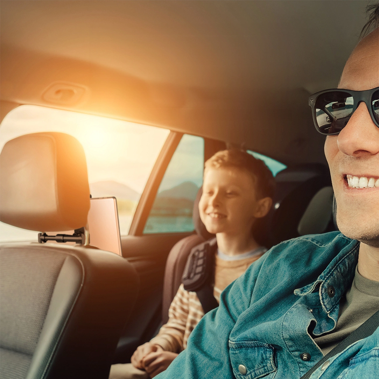 Baseus Backseat Car Mount mounted on the headrest while traveling