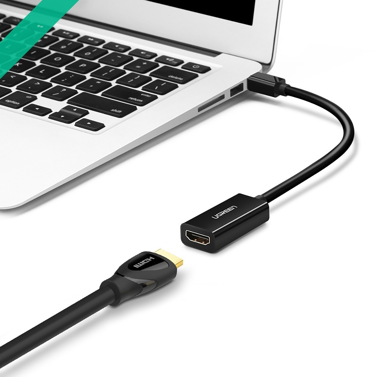 Macbook with connected Ugreen MD112 adapter with mini DisplayPort (male) and HDMI (female) connectors with Full HD 1080p resolution