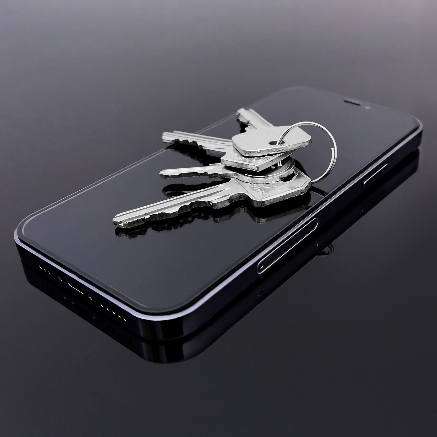 Keys lying on Wozinsky Full Glue Tempered Glass