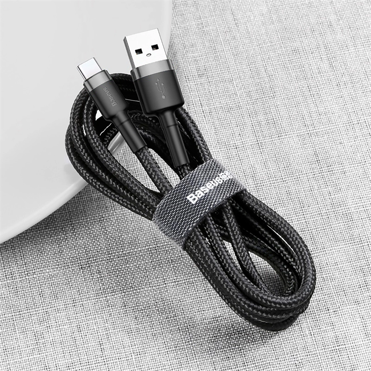Baseus Cafule USB-A / USB-C cable rolled up and fastened with Velcro