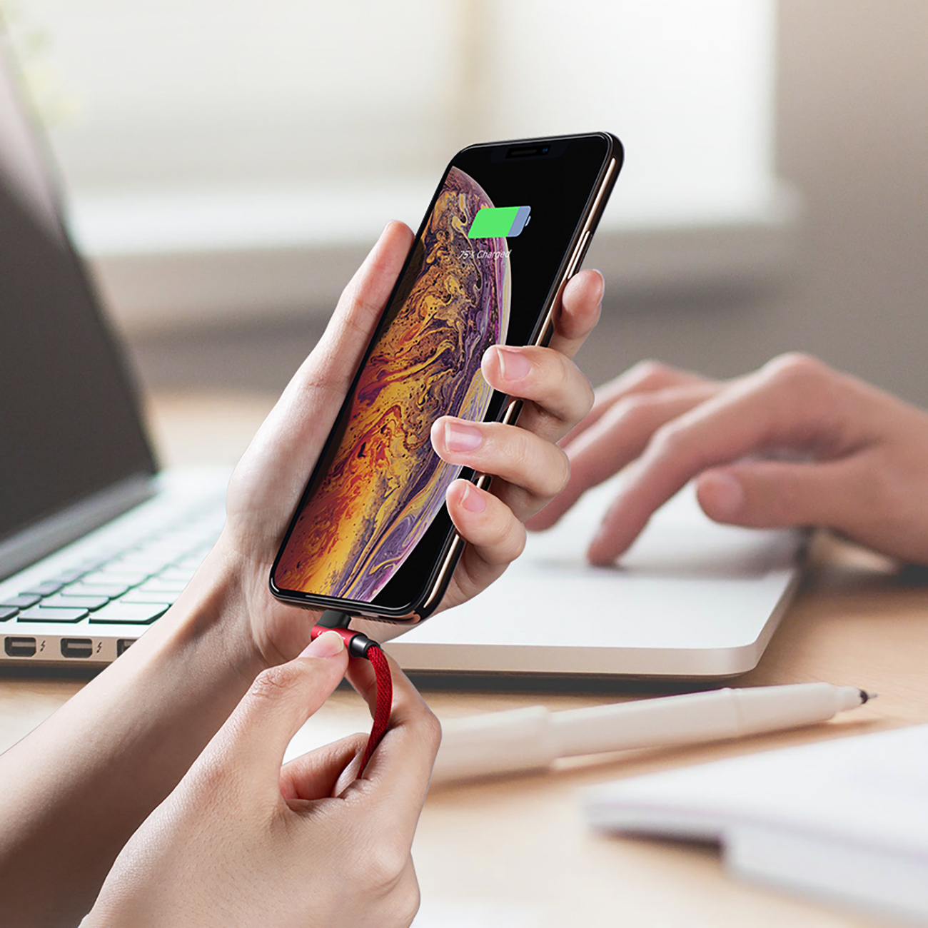 Female hands connecting a smartphone to charge using the Ugreen US299 60555 cable