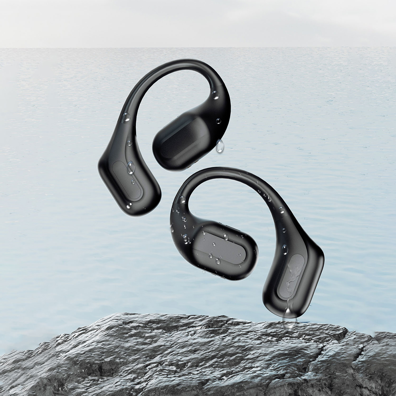 Dudao U17Pro on-ear wireless headphones on a rock, with the sea in the background