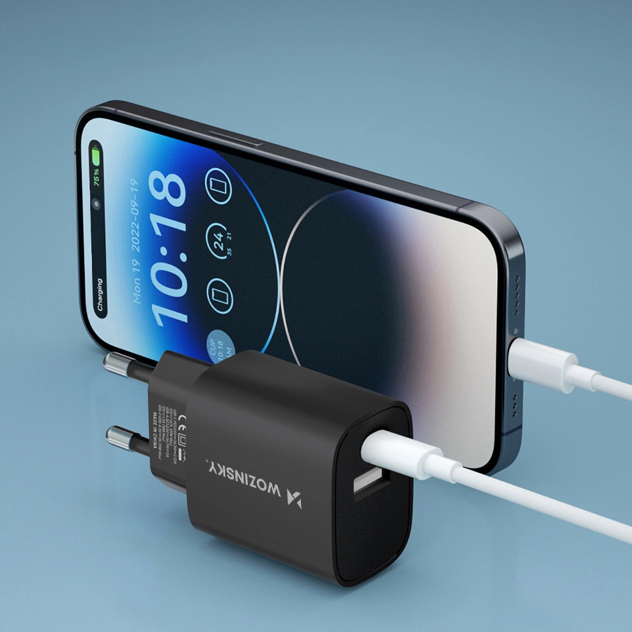 iPhone connected to the Wozinsky WGWCB wall charger with USB-A and USB-C connectors with a power of up to 20W via a white cable