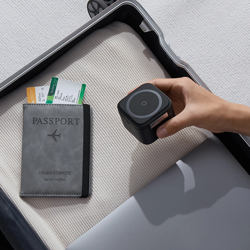 A hand putting the Baseus BS-W531 2-in-1 wireless charger into a travel suitcase