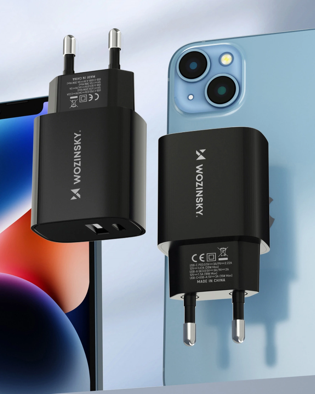 Two Wozinsky WGWCB chargers with USB-A and USB-C connectors with a power of up to 20W against the background of an iPhone and iPad