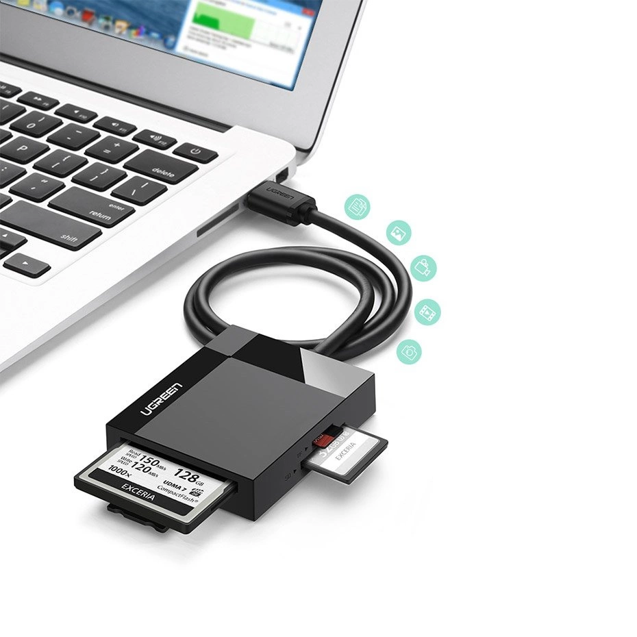 Ugreen CR125 memory card reader connected to a laptop