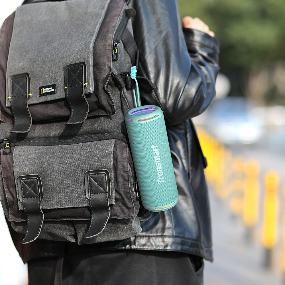 Tronsmart T7 Lite wireless speaker attached to a backpack