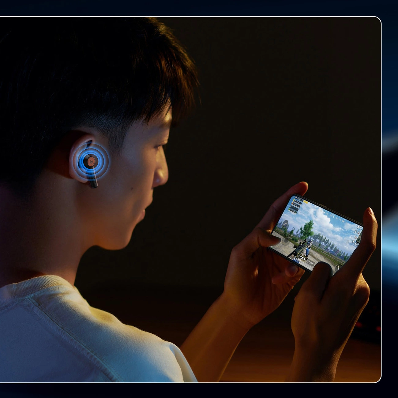 A man plays on the phone while listening to sounds from Choetech BH-T19 EyeAura Minionz TWS wireless headphones