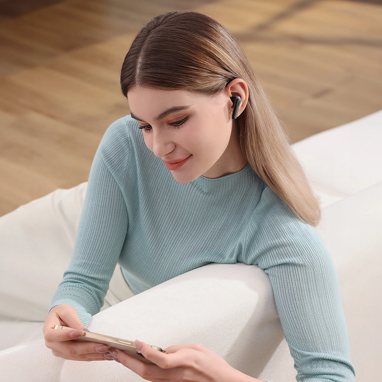 Woman with Baseus Bowie E12 wireless headphones using the Baseus application