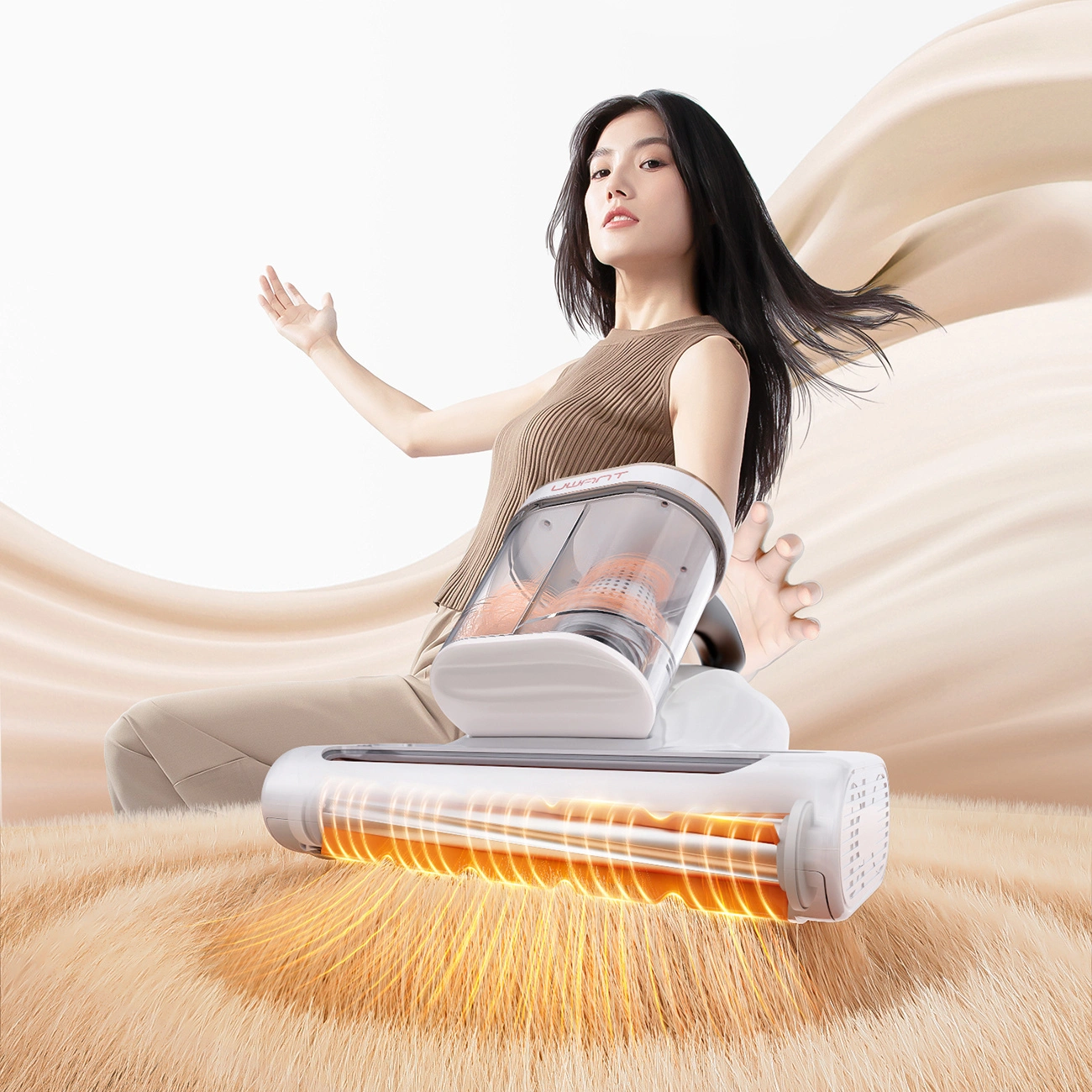 A woman holds a UWANT M600 vacuum cleaner in her hand
