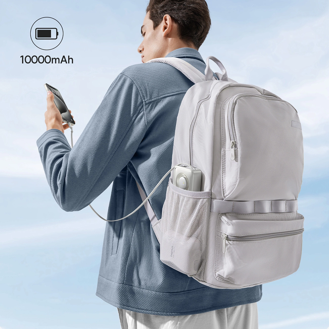 The man carries the Baseus Free2Pull Powerbank in the side pocket of his backpack