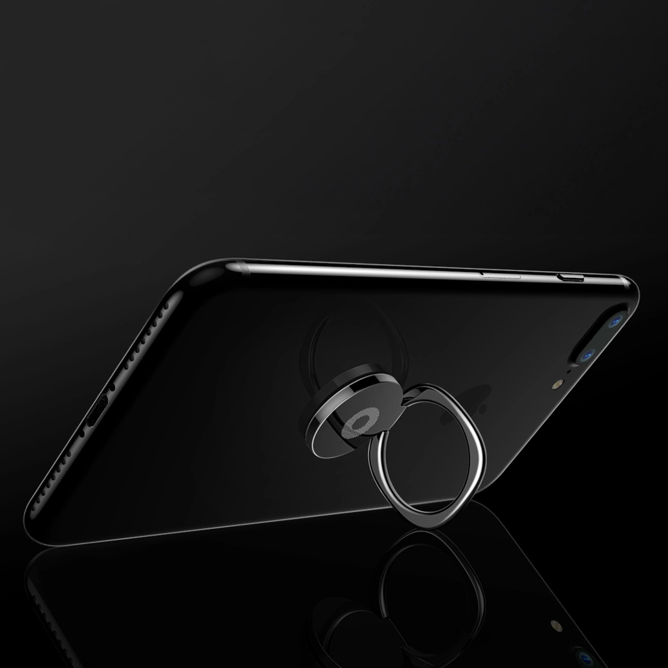 An unfolded Baseus Privity Ring holder with an attached phone leaning on a glass floor on a black background