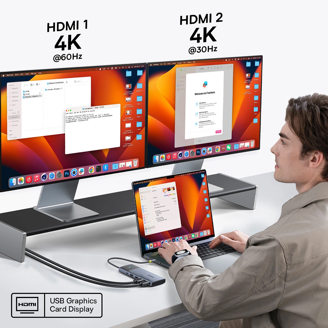 The man uses a computer connected to two monitors using a Baseus Metal Gleam Series II HUB