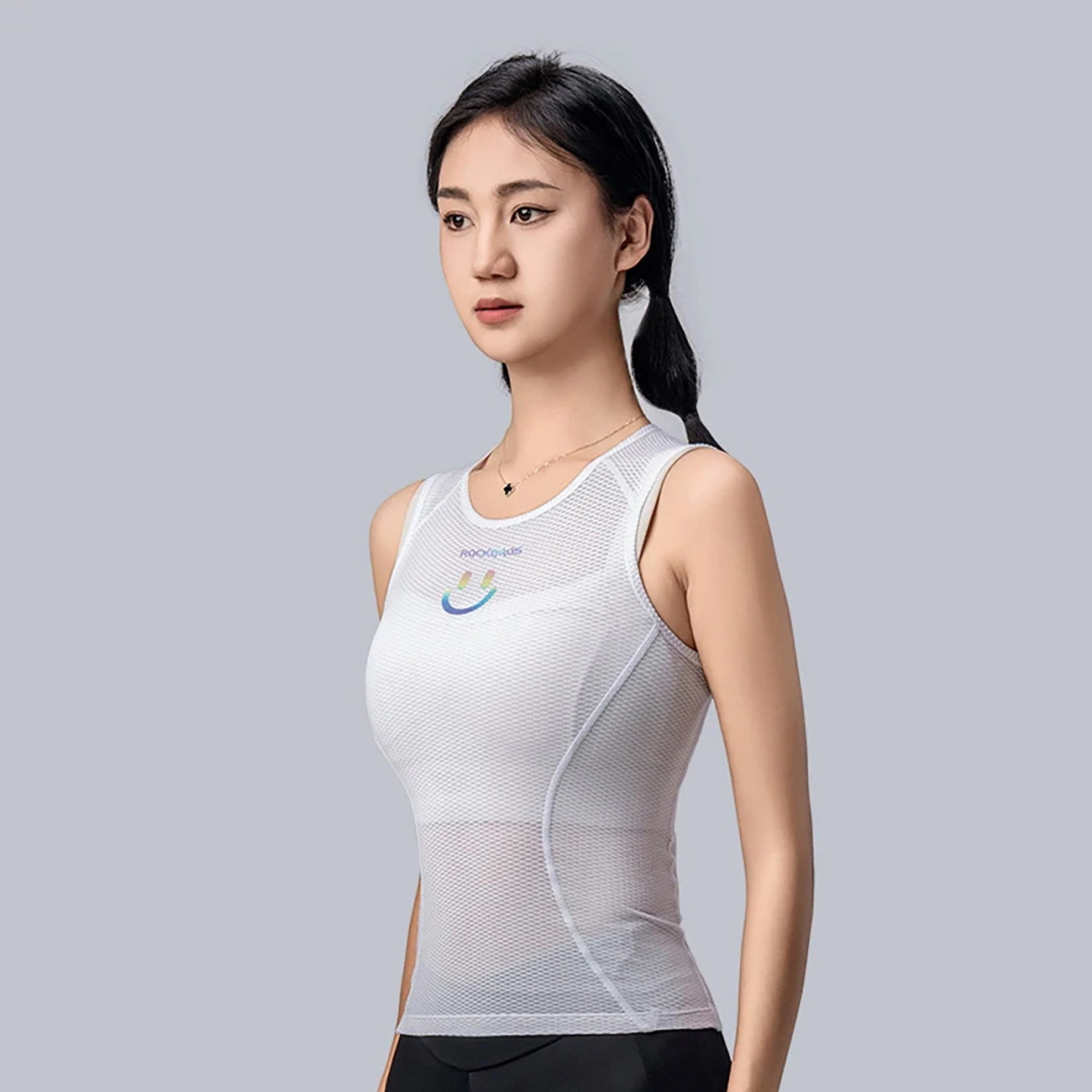 Woman wearing Rockbros YDBX001 cycling vest standing sideways to the camera