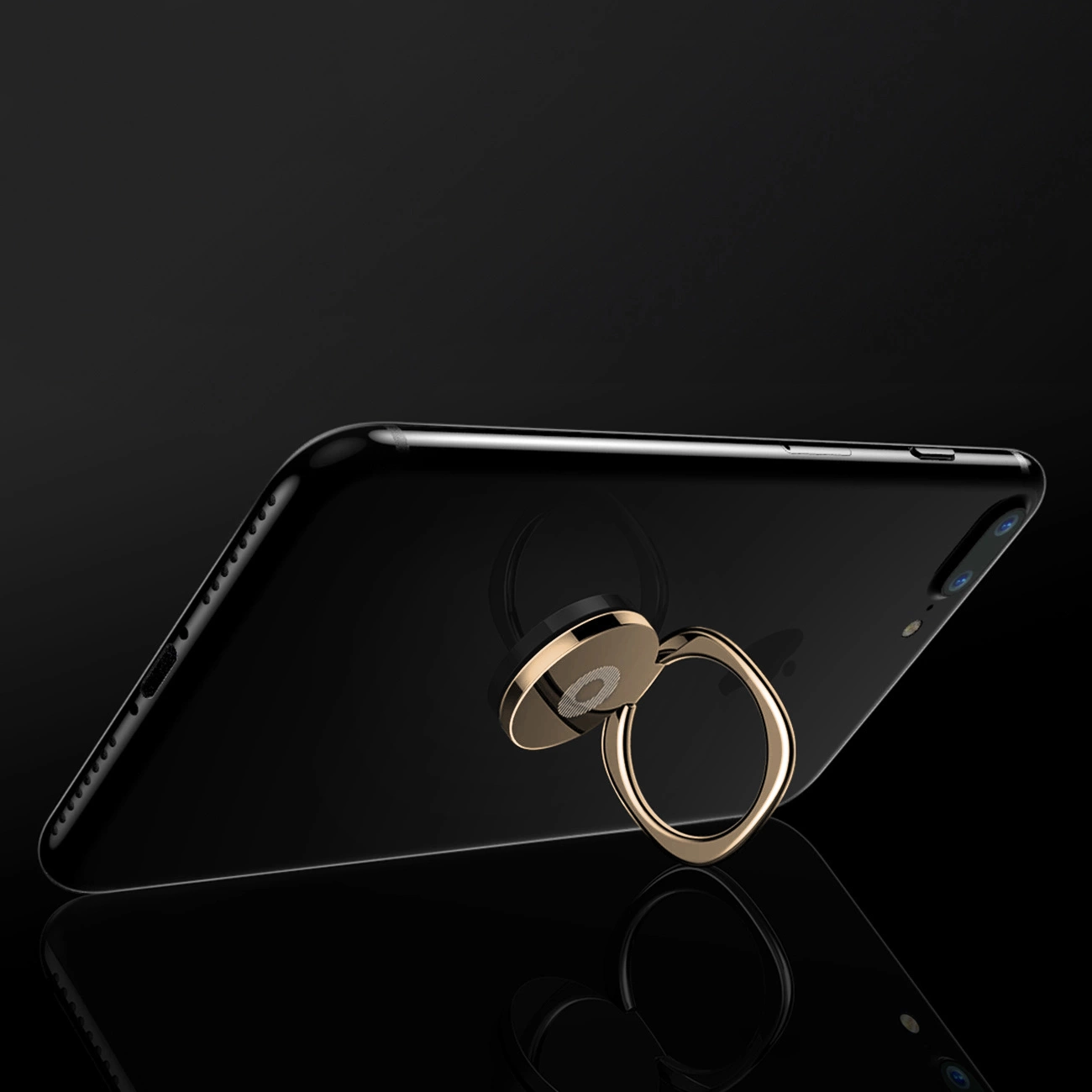 An unfolded Baseus Privity Ring holder with an attached phone leaning on a glass floor on a black background