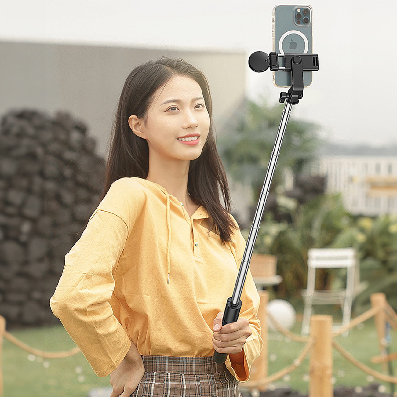 Woman posing with a WH1YXS selfie stick