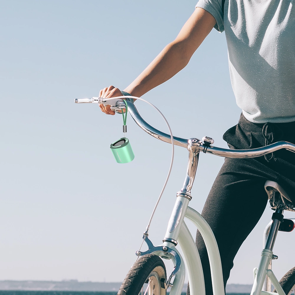 Man on bike with Tronsmart Nimo mini speaker